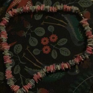 A blue and pink seashell necklace